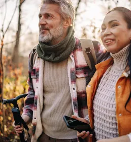 Couple walking in woodland setting