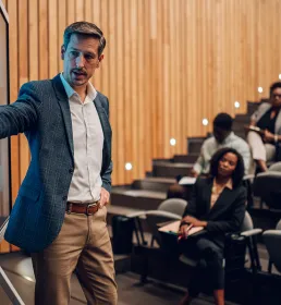Male lecturer presenting and teaching