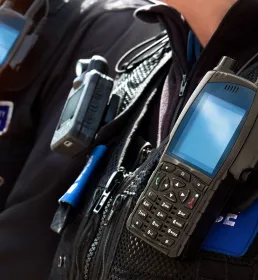 Close up of UK police uniform and walkie talkies