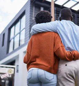 Couple outside sold house