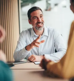 Director meeting with colleagues