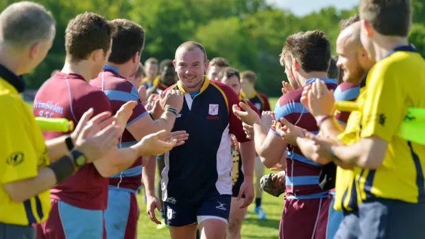 Rugby players clapping the man of the match