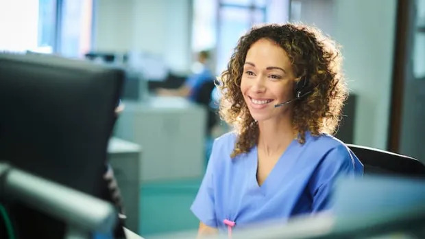 Nurse sitting infront of computer screen