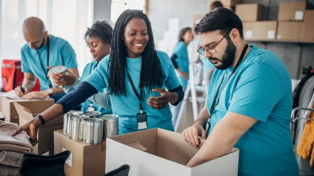Charity workers packing boxes