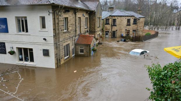 Flooded village of pub and houses 