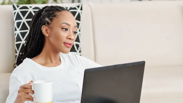 Woman watching webinar Woman watching webinar