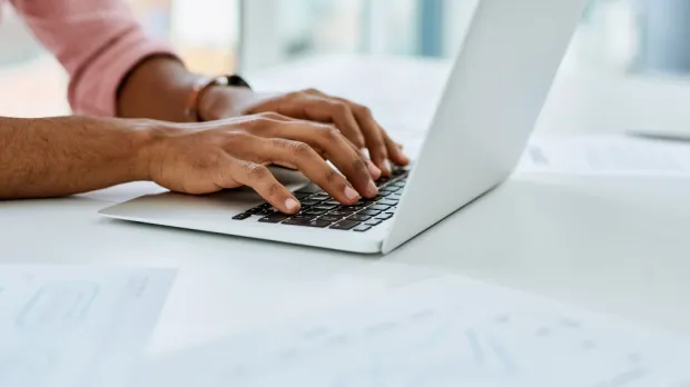 typing on a laptop
