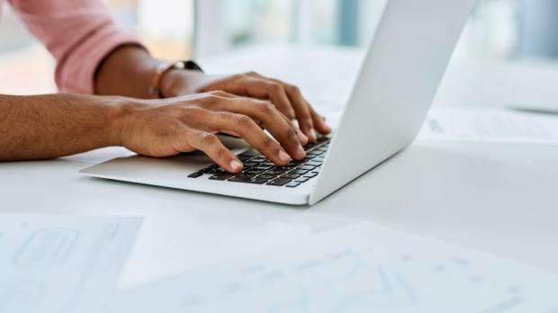 typing on a laptop typing on a laptop