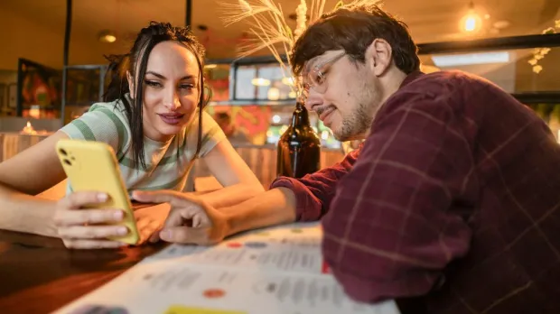 two people looking at phone