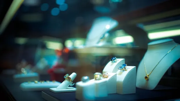 Jewellery on display at night including rings and gems