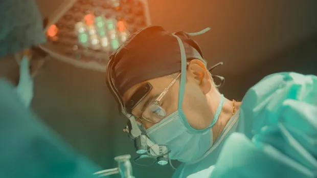 Health & Care climate whitepaper: surgeon completing procedure