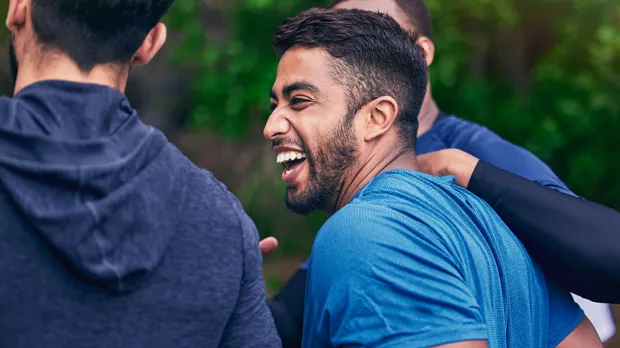 Mens health at work - Article image Men laughing in a park