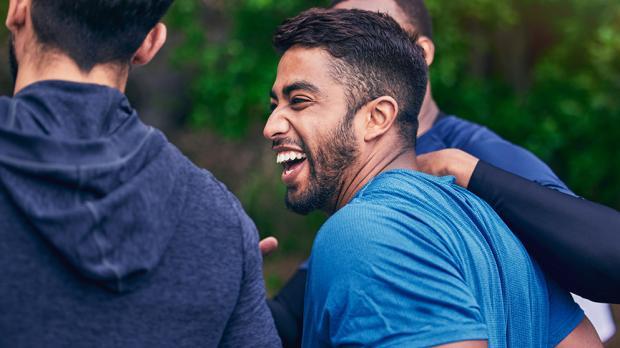 Men laughing in a park