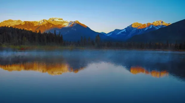 Reflection of summer mountains in a lake