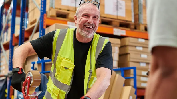 Older man working in warehouse