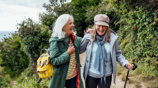 Women going for a walk and laughing