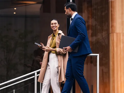 professionals talking outside an office building