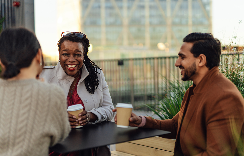 Colleagues having coffee together