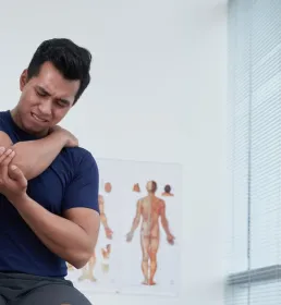 A man at the doctors with an arm injury