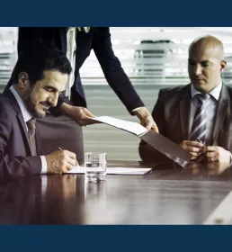 businessmen sitting around table