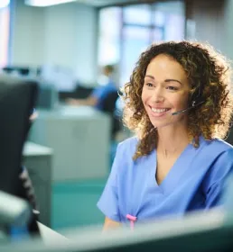 Nurse sitting infront of computer screen