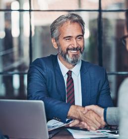 Tow businessmen shaking hands in a meeting