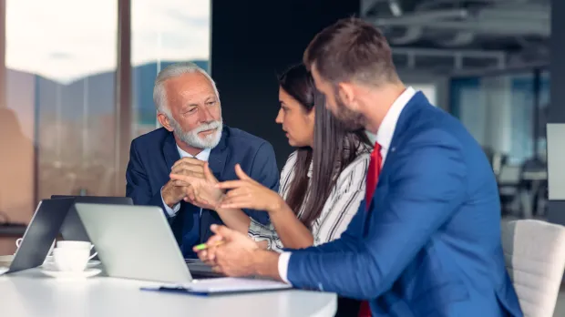 Discussion between three employees on group income protection