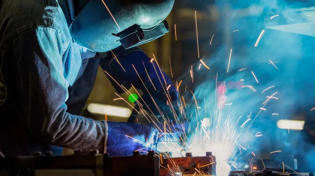 Product Liability Image of someone crafting metal with sparks flying