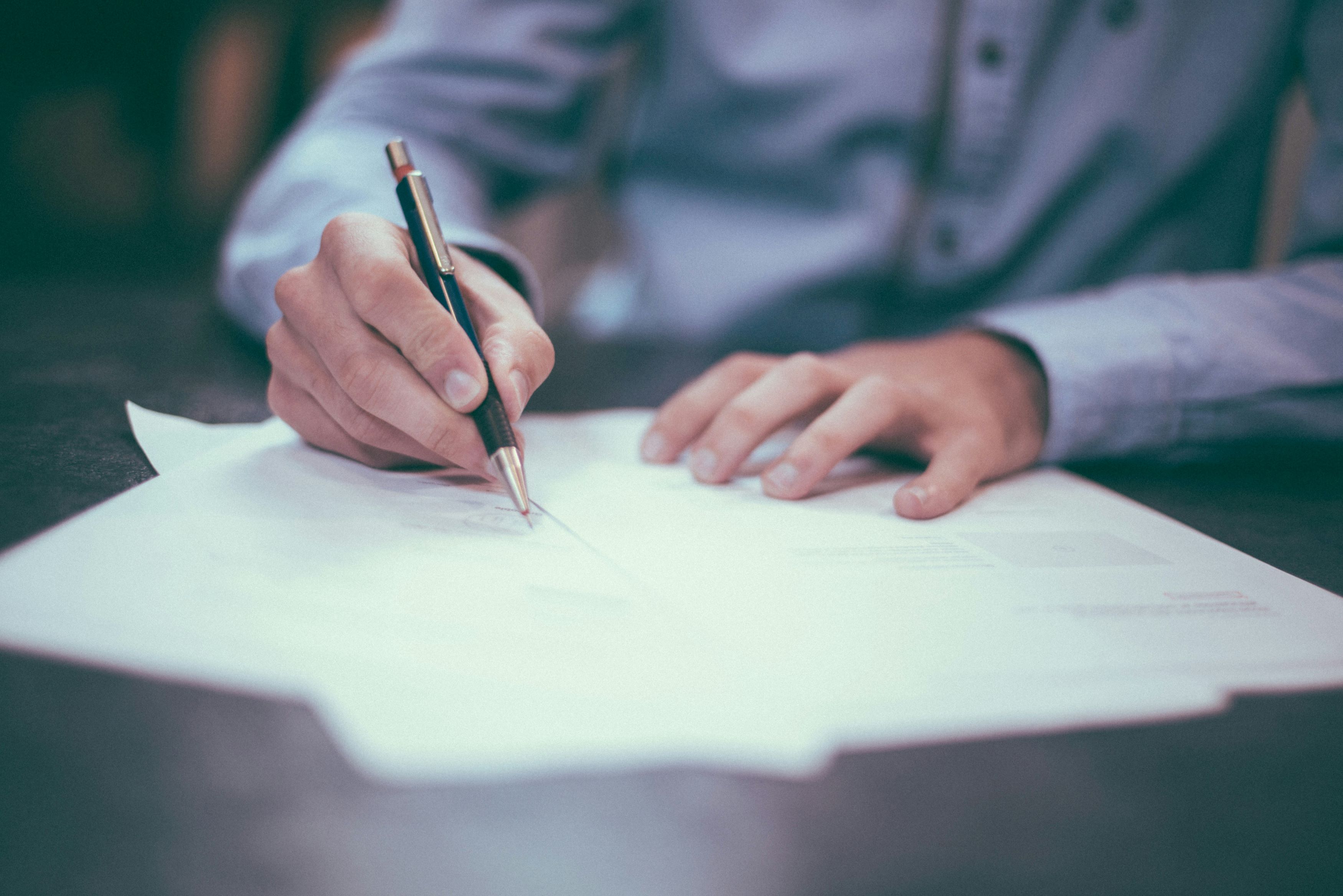 An image of a businessperson writing