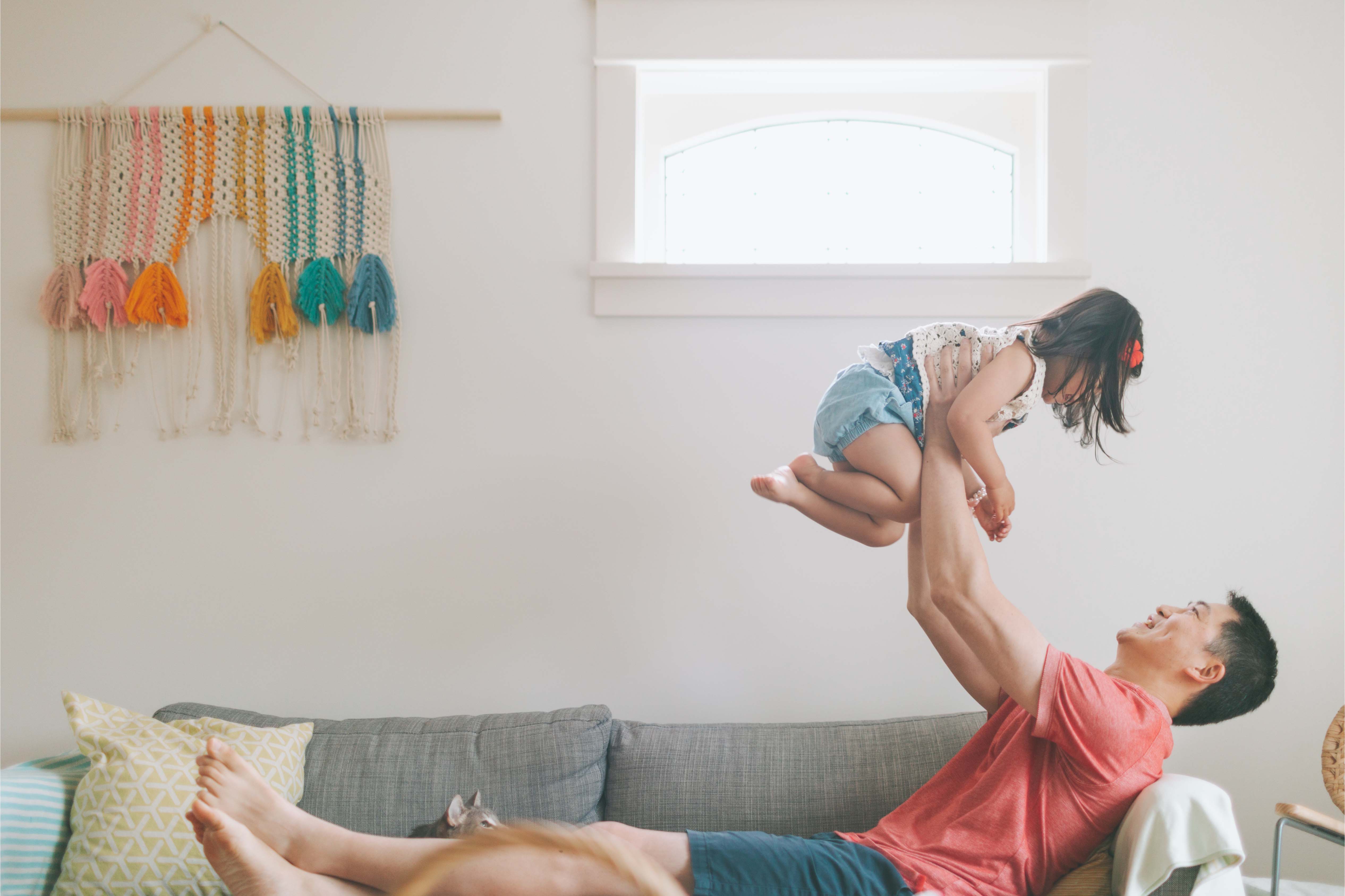 Father Carrying His Daughter Up in the Air