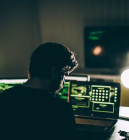 Cyber criminal coding late at night