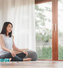 Woman Doing Yoga Meditation at Home