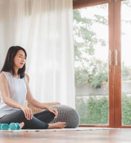 Woman Doing Yoga Meditation at Home