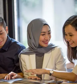 Young malaysian friends having fun indoors