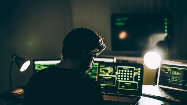 Cyber criminal coding late at night