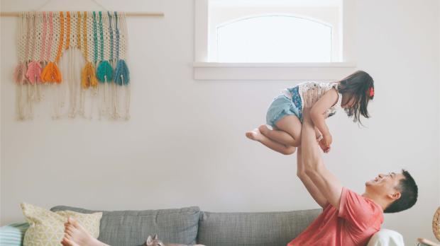 Father Carrying His Daughter Up in the Air