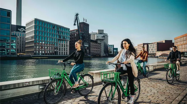 Group of Friends Riding a Bike Together