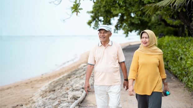 Senior Asian Couple Walking and Exercising