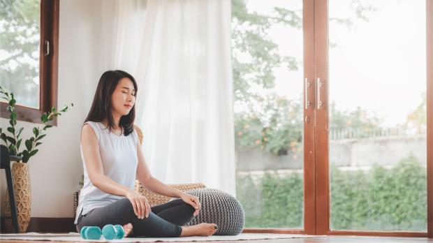 Woman Doing Yoga Meditation at Home