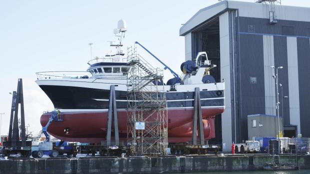 A large boat in a shipyard