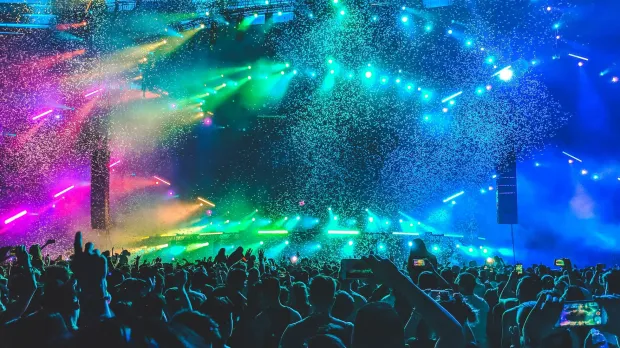 Live event, festival Rainbow lighting illuminating crowd at large live event