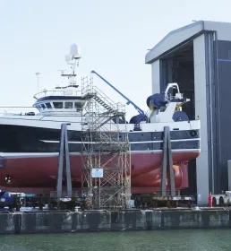A large boat in a shipyard