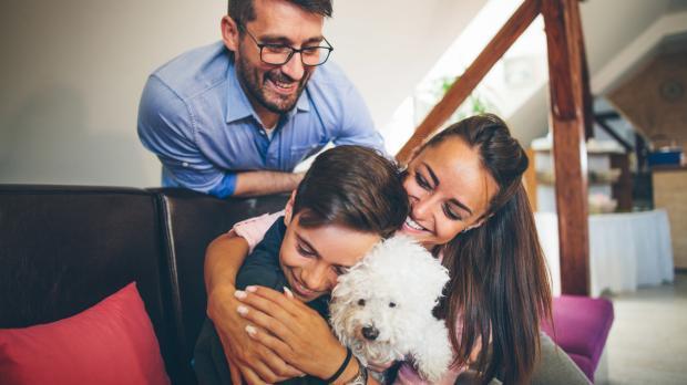 Employee benefits Howden Turkey people smiling and laughing with dog 