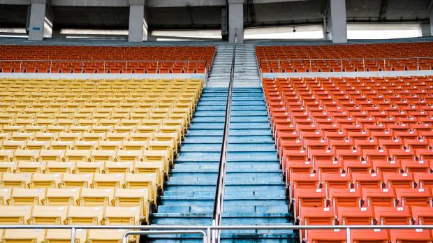 A view from the pitch of rows of empty stadium seats