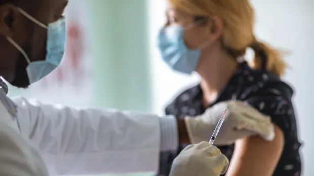 Woman receiving vaccination