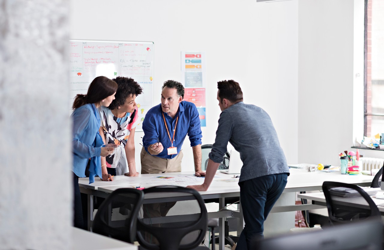 A team of people discussing over the table