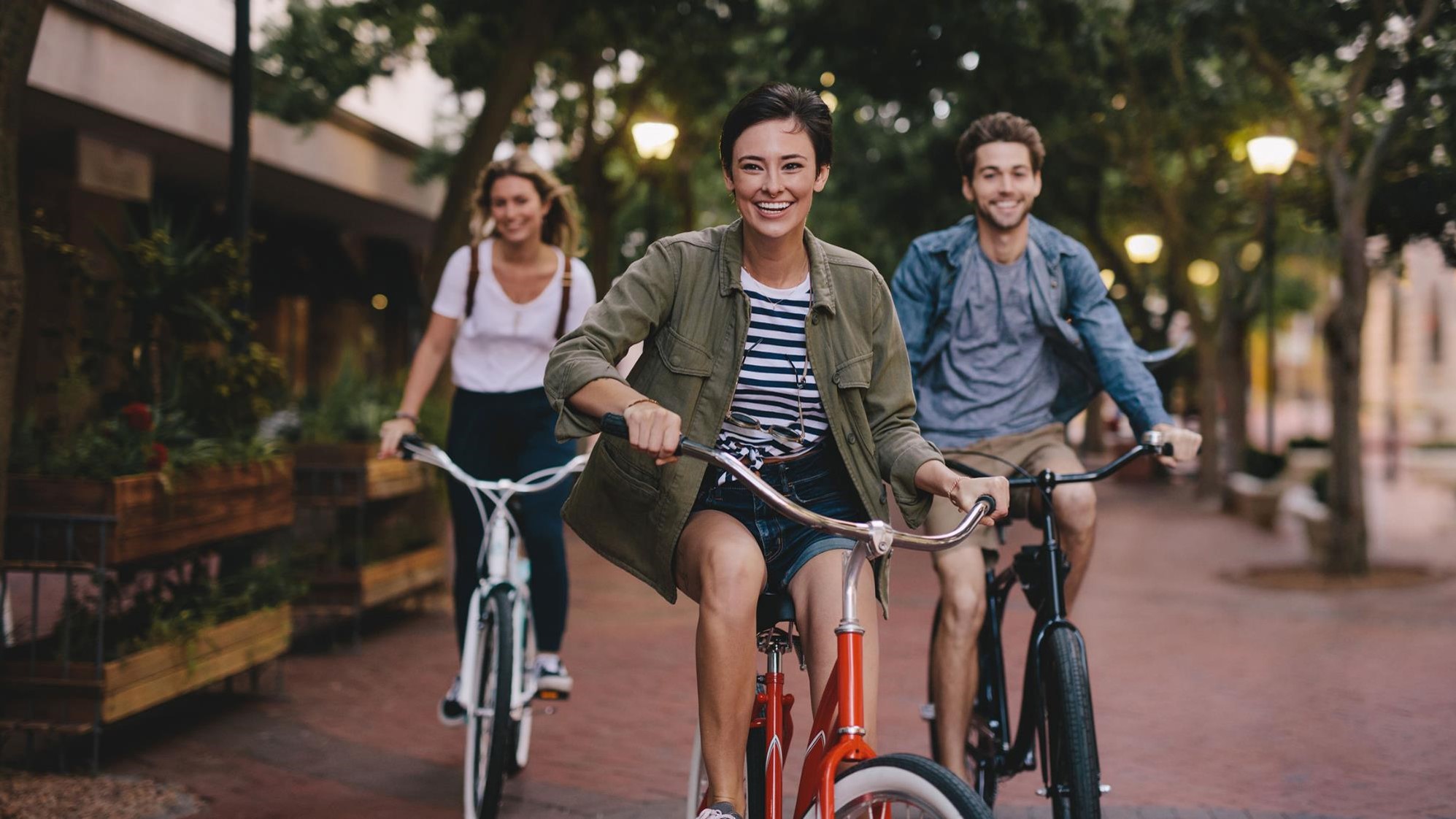 People riding on bikes, lauging