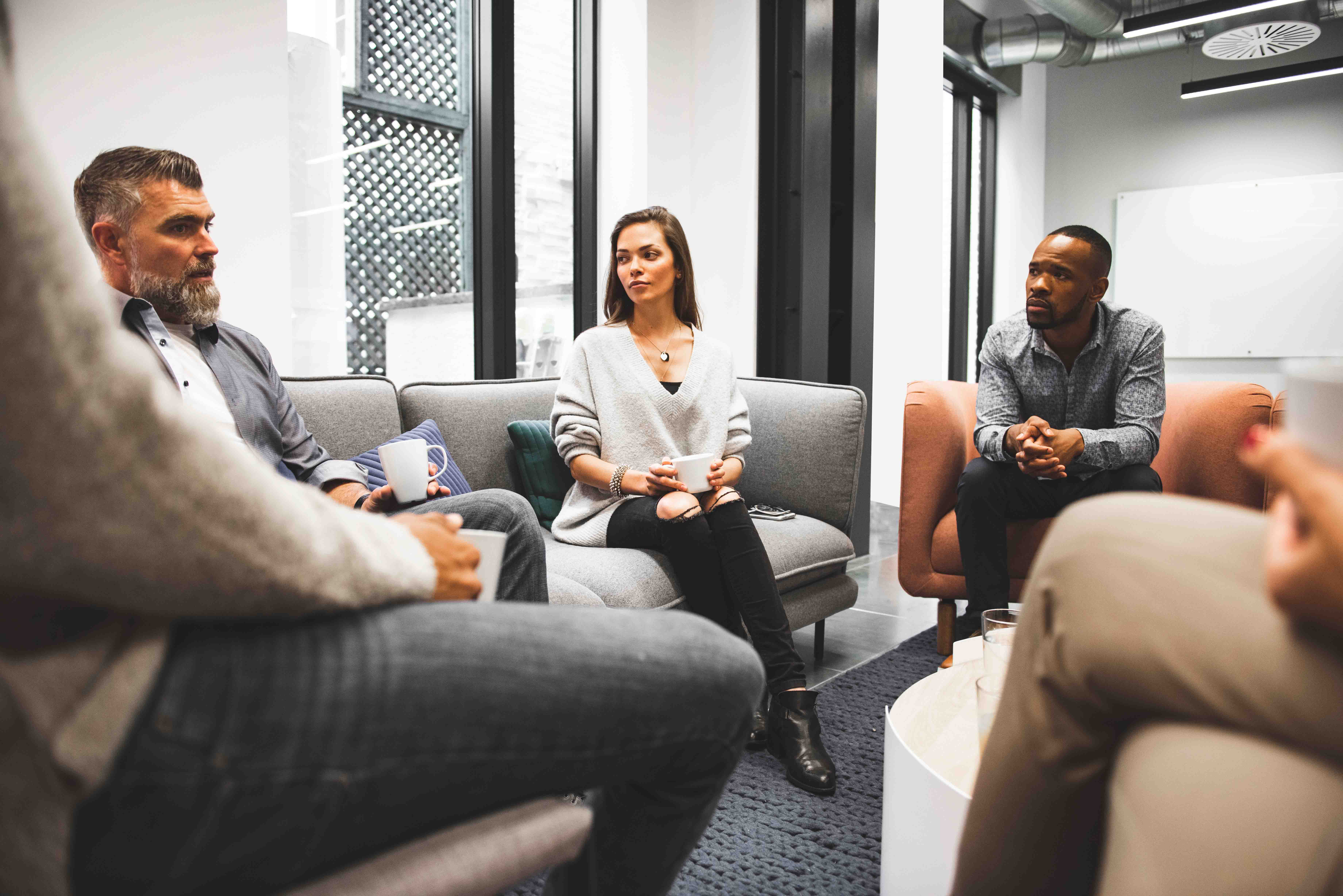 Colleagues sitting together having coffee