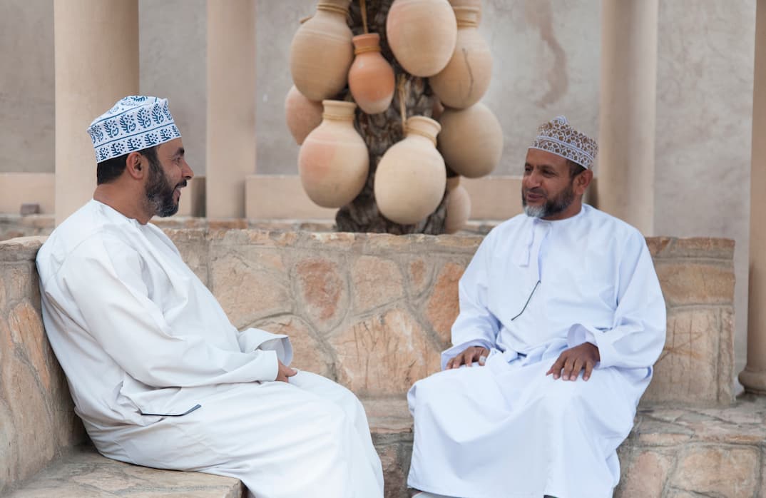 Two men discussing a deal