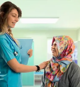 Woman doctor and elderly female patient